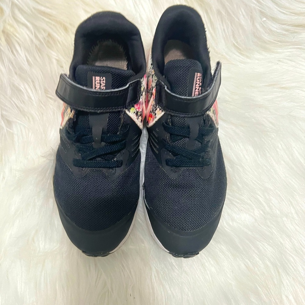 Worn out Nike flower shoes